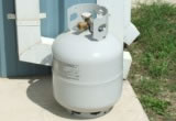 Propane cylinders should be stored on a level non-combustible surface
