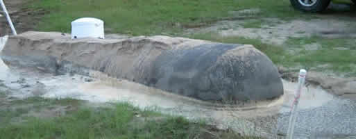 Underground propane tank floating after hole fills with water